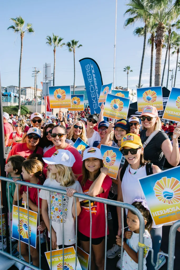 Families and children holding HBEF signs at the 2026 Skechers Friendship Walk
